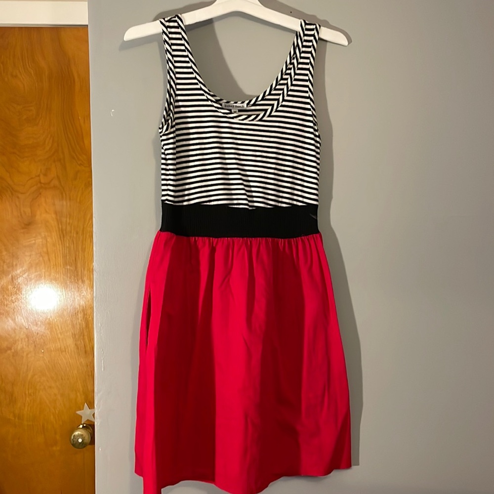 Velvet Torch black and white striped. Red at the skirt